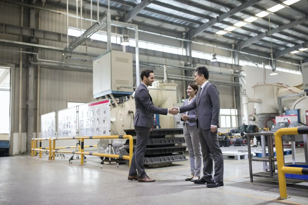 business-people-shaking-hands-in-the-factory.jpg